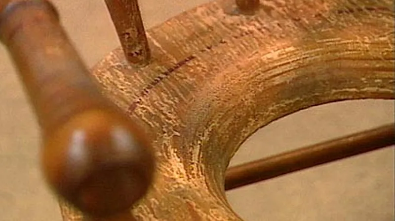 A 19th-century child's potty chair with faded paint.