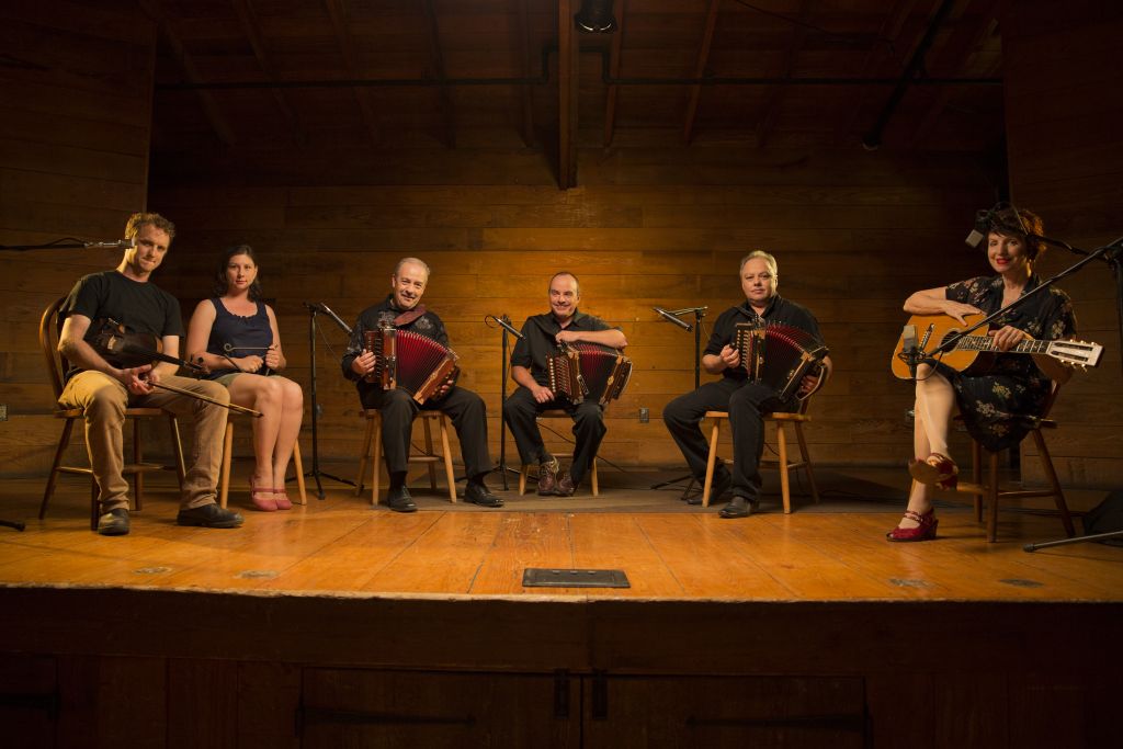 The Breaux Fréres (middle three) with Louis Michot, Ashlee Michot, and Anne Savoy Appearing in “American Epic: Out of the Many, the One.” Credit: ©2017 Lo-­‐Max Records Ltd.