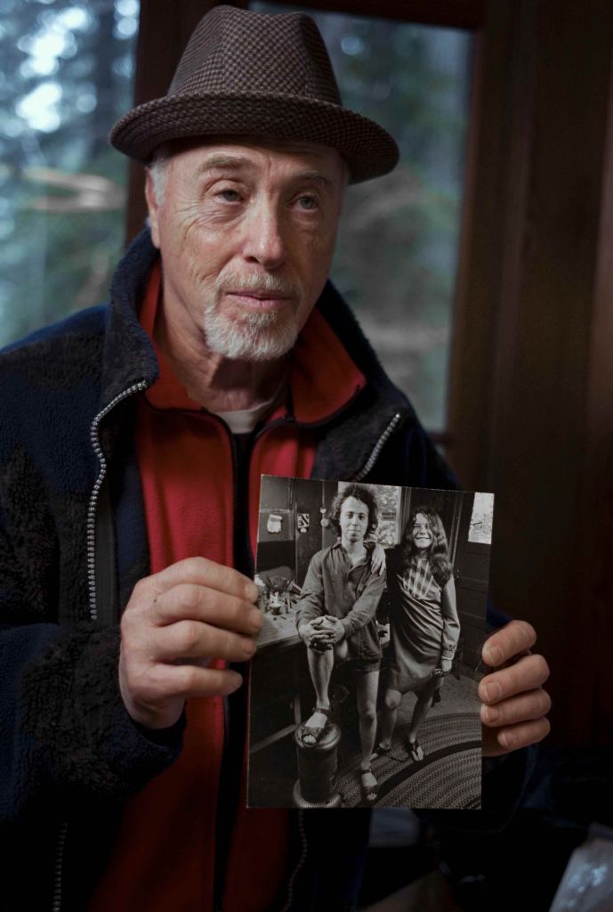 Big Brother and the Holding Company drummer Dave Getz, holding a photo of himself with Janis Joplin