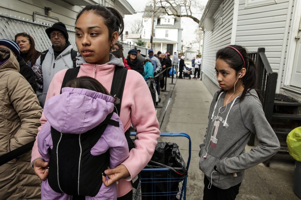 Claudia Morones, a high school senior, w her baby girl and sister at the River Fund in Queens. 3 yrs later, she is in tech college, studying auto repair.