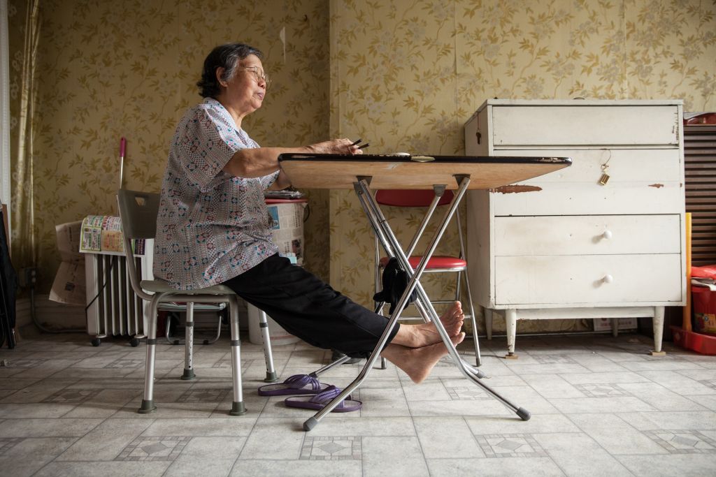 Do Mui Lee lives alone in a rooming house and visits the pantry at Our Lady of Perpetual Help in Sunset Park, Brooklyn.
