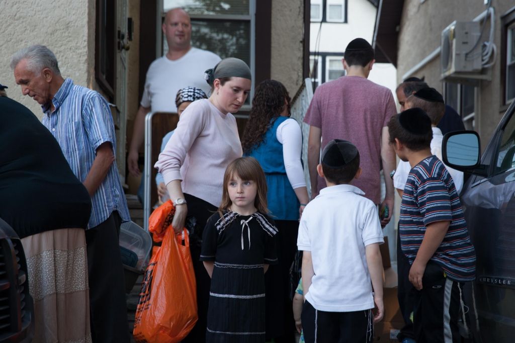 In Midwood, families line up on Fridays for bread for Sabbath dinner.