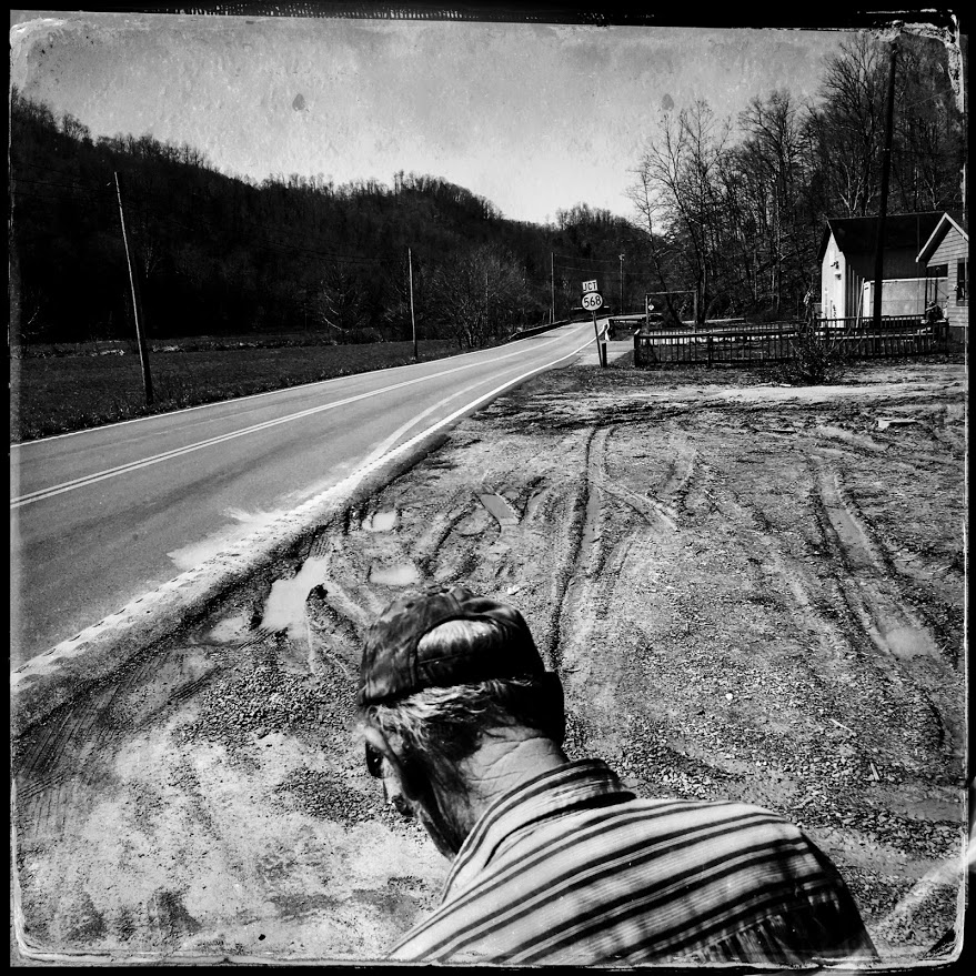 Chester Napier walks along the road in Cranks Creek