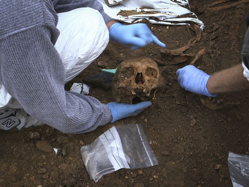 Missing person investigators at a suspected mass grave site in Bugjono, Bosnia-Herzegovina. Credit: Jonathan Silvers
