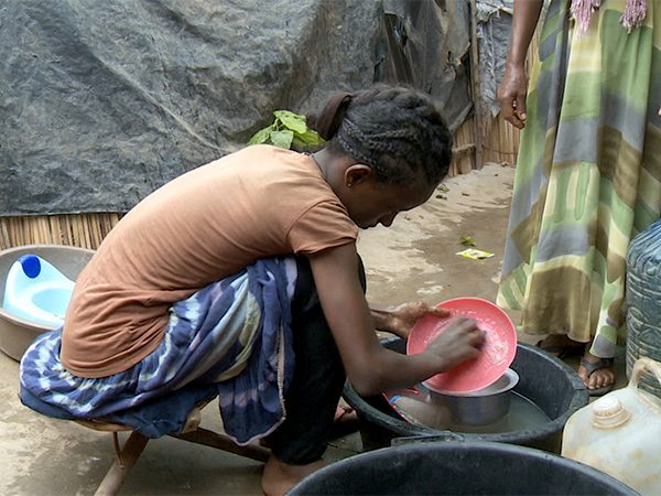 Girl Doing Chores in Uganda