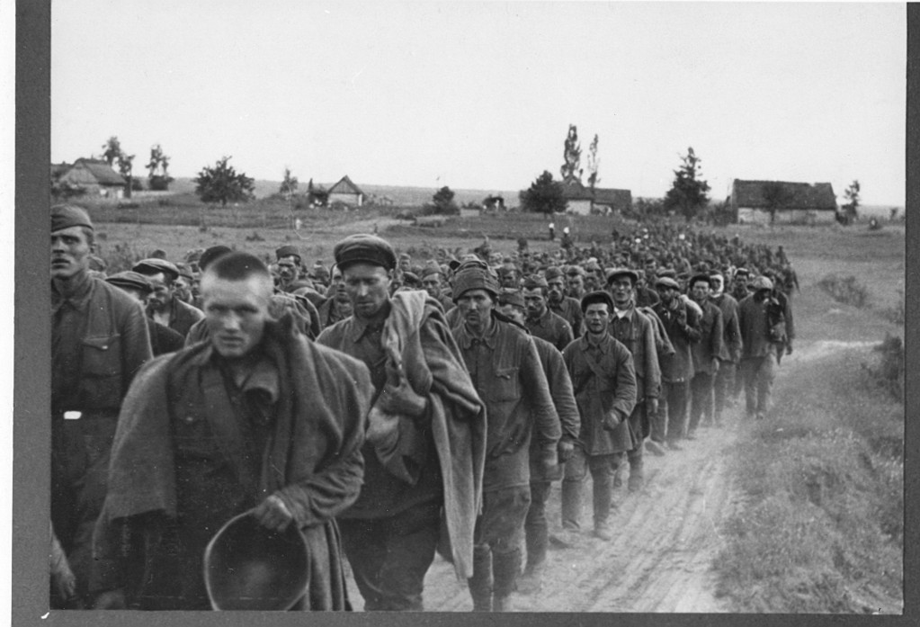 Russian prisoners of war march down road.