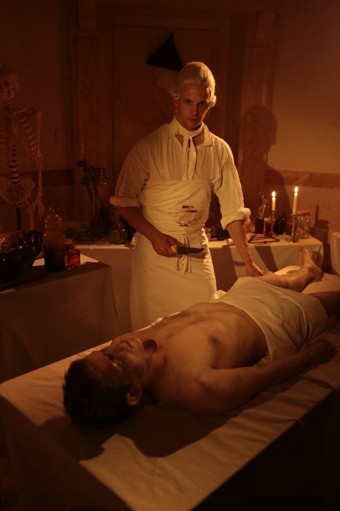  Reconstruction - Hewson with cadaver and surgical knife. 