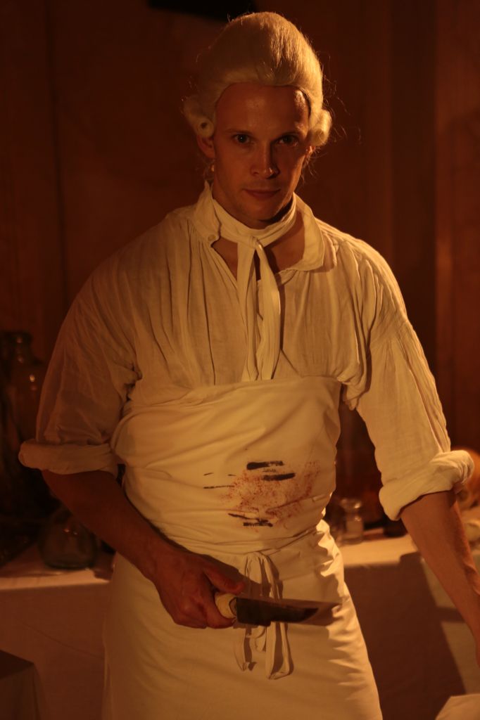  Reconstruction - Hewson with cadaver and surgical knife. 