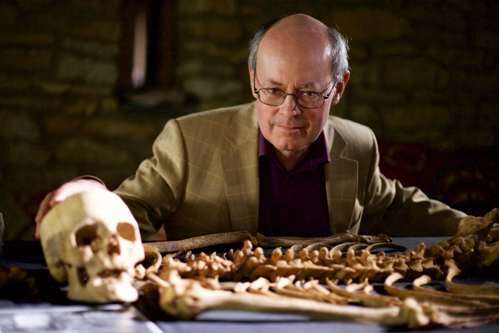 Professor John Blair examines the bones of a female deviant burial.