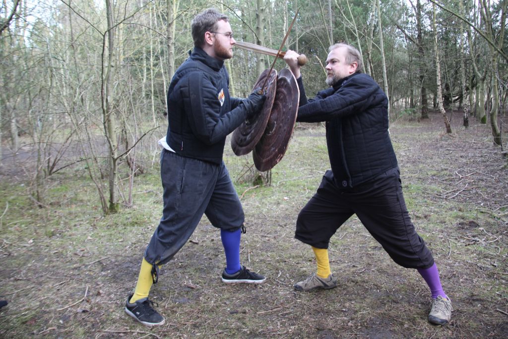 Mark Belshaw and Robert Brooks battering shields