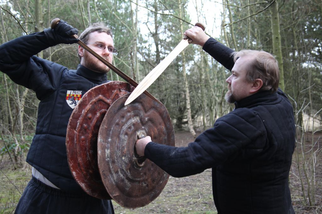 Mark Belshaw and Robert Brooks doing battle with their bronze swords