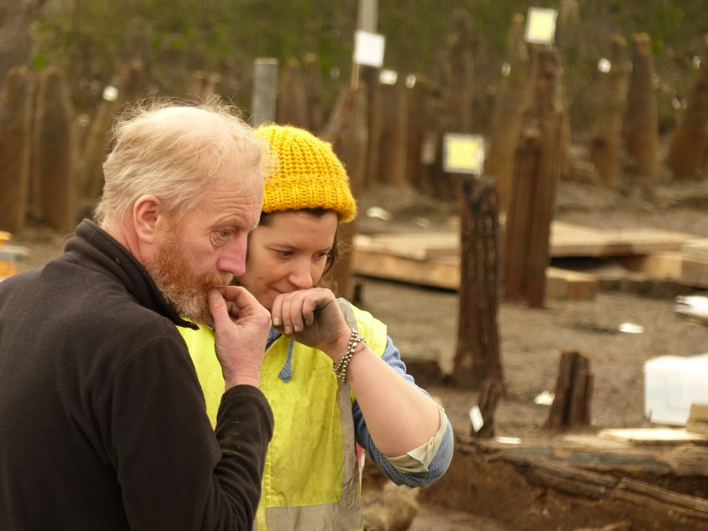Mark Knight and Archaeologist both with their hands to their mouths looking out of frame.